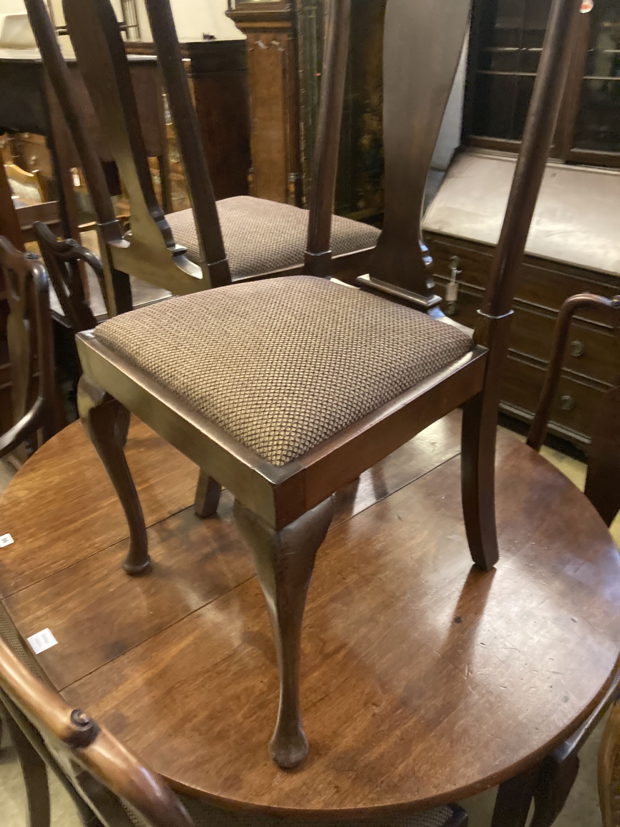 A set of eight early 20th century Queen Anne style mahogany dining chairs (two arm, six single)